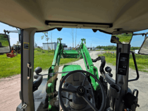 View from the driver's seat inside the John Deere 6140M