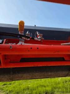 Underside of the Kubota M32 loader showing hydraulic connections