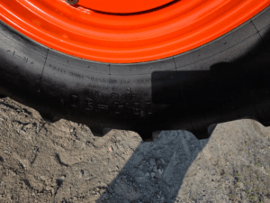 Front agricultural tire on the 2019 Kubota M5-111 tractor in excellent condition