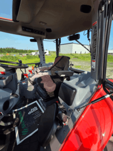 Interior of the 2019 Kubota M5-111 cab with suspension seat