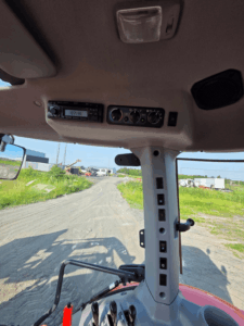 Radio and climate control panel inside the 2019 Kubota M5-111 cab