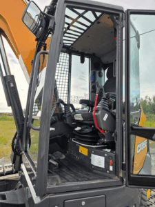 Interior of 2024 Case CX85E excavator cab with seat and controls