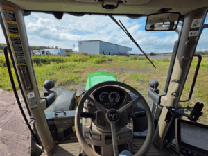 Operator station inside 2016 John Deere 6145R tractor